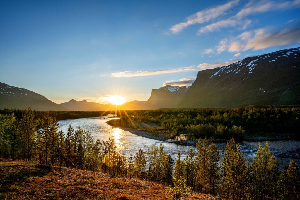 Midnight sun Reisadalen with Røyelkampen mountain and Reisa river